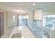 Kitchen island with white countertop and modern pendant lights at 6850 E Mcdowell Rd # 7, Scottsdale, AZ 85257