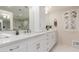 Modern bathroom with white cabinets, quartz countertops, and a walk-in shower at 6945 E Glenrosa Ave, Scottsdale, AZ 85251