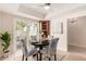 Cozy breakfast nook with round table and chairs, adjacent to sliding glass doors at 6945 E Glenrosa Ave, Scottsdale, AZ 85251