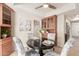 Small dining area with round table, four chairs, and built-in hutch at 6945 E Glenrosa Ave, Scottsdale, AZ 85251