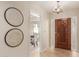 Bright and spacious entryway with decorative wall art and hardwood floors at 6945 E Glenrosa Ave, Scottsdale, AZ 85251