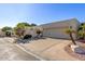 Single story home with light colored stucco and attached garage at 6945 E Glenrosa Ave, Scottsdale, AZ 85251