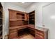 Home office features built-in wood desk and shelving at 6945 E Glenrosa Ave, Scottsdale, AZ 85251
