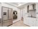 Stainless steel appliances and white cabinetry in this updated kitchen at 6945 E Glenrosa Ave, Scottsdale, AZ 85251