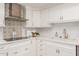 White cabinets, quartz countertops, and stainless steel appliances at 6945 E Glenrosa Ave, Scottsdale, AZ 85251