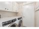 Laundry room with washer, dryer, and cabinets at 6945 E Glenrosa Ave, Scottsdale, AZ 85251