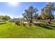 Expansive lawn with mature trees and landscaping at 6945 E Glenrosa Ave, Scottsdale, AZ 85251