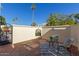 Inviting patio with brick flooring, wrought iron gate, and comfortable seating at 6945 E Glenrosa Ave, Scottsdale, AZ 85251