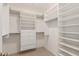 Spacious walk-in closet with ample shelving and drawers at 6945 E Glenrosa Ave, Scottsdale, AZ 85251