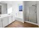 Main bathroom with double vanity, tub and shower at 703 W Magena Dr, San Tan Valley, AZ 85140