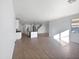 Bright and spacious living room with wood-look tile floors at 703 W Magena Dr, San Tan Valley, AZ 85140