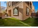 Small grassy backyard with patio and AC unit at 750 W Flintlock Way, Chandler, AZ 85286
