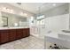 Elegant bathroom with double vanity, large shower, and separate tub at 750 W Flintlock Way, Chandler, AZ 85286