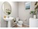 Clean powder room with pedestal sink and stylish decor at 750 W Flintlock Way, Chandler, AZ 85286