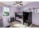 Bedroom with bunk beds, nightstand and decorative wall at 750 W Flintlock Way, Chandler, AZ 85286