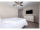 Cozy bedroom with ceiling fan and dresser at 750 W Flintlock Way, Chandler, AZ 85286