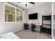 Bedroom with workspace, window seat, and ample natural light at 750 W Flintlock Way, Chandler, AZ 85286