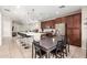 Modern kitchen with island, stainless steel appliances, and breakfast nook at 750 W Flintlock Way, Chandler, AZ 85286