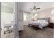 Spacious main bedroom with ensuite bathroom and ceiling fan at 750 W Flintlock Way, Chandler, AZ 85286