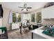 Home office with a large desk, built in shelving and cabinet storage at 750 W Flintlock Way, Chandler, AZ 85286