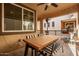 Covered patio with dining table and string lights at 750 W Flintlock Way, Chandler, AZ 85286