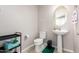 Clean powder room with pedestal sink and tile flooring at 750 W Flintlock Way, Chandler, AZ 85286
