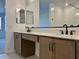 Bathroom featuring double sinks with modern hardware at 7638 W Rowel Rd, Peoria, AZ 85383
