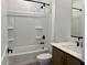 Well-lit bathroom featuring a shower over the tub and a modern vanity with a white countertop at 7638 W Rowel Rd, Peoria, AZ 85383