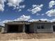 An exterior elevation of a single-Gathering home under construction showcases its modern architectural style and sturdy structure at 7638 W Rowel Rd, Peoria, AZ 85383