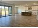 Spacious living area with wood-look tile floors and lots of natural light at 7638 W Rowel Rd, Peoria, AZ 85383