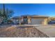 Single-story home with desert landscaping and a two-car garage at 9020 E Brittle Bush Rd, Gold Canyon, AZ 85118