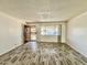 Bright living room with wood-look floors and entryway at 9817 N 43Rd Dr, Glendale, AZ 85302