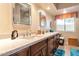 Bathroom features double sinks and granite countertops at 10023 E Sunnyslope E Ln, Scottsdale, AZ 85258