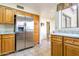 Kitchen boasts stainless steel refrigerator and granite counters at 10023 E Sunnyslope E Ln, Scottsdale, AZ 85258