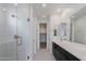Modern bathroom boasts double vanity, walk-in shower, and elegant fixtures at 10236 E Ursula Ave, Mesa, AZ 85212
