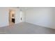Spacious bedroom with plush carpeting and en-suite bathroom access at 10236 E Ursula Ave, Mesa, AZ 85212
