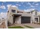 Stylish two-story house with a dark-toned garage and front yard at 10236 E Ursula Ave, Mesa, AZ 85212