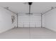 Spacious garage with overhead door and ample storage space at 10236 E Ursula Ave, Mesa, AZ 85212