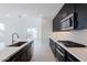 Modern kitchen with island, sink, and backyard view at 10236 E Ursula Ave, Mesa, AZ 85212