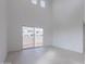 Bright living room with high ceilings and access to backyard at 10236 E Ursula Ave, Mesa, AZ 85212