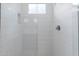 Clean and bright shower with glass enclosure and modern tile at 10236 E Ursula Ave, Mesa, AZ 85212