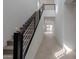 Modern staircase with metal railing and carpeted steps at 10236 E Ursula Ave, Mesa, AZ 85212