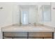 Double vanity bathroom with modern fixtures and large mirror at 10249 E Ulysses Ave, Mesa, AZ 85212