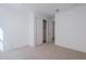 Bright bedroom with neutral carpeting and ample closet space at 10249 E Ulysses Ave, Mesa, AZ 85212