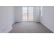 Bedroom with sliding door to balcony and city views at 10249 E Ulysses Ave, Mesa, AZ 85212