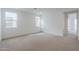 Spacious bedroom with neutral carpet and large windows at 10249 E Ulysses Ave, Mesa, AZ 85212