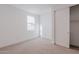 Bright bedroom with carpet flooring and sliding closet doors at 10249 E Ulysses Ave, Mesa, AZ 85212