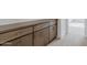 Built-in hallway storage with dark brown cabinets at 10249 E Ulysses Ave, Mesa, AZ 85212