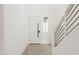 Bright and airy entryway with modern door and staircase at 10249 E Ulysses Ave, Mesa, AZ 85212