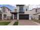 Modern two-story home with a two-car garage and balcony at 10249 E Ulysses Ave, Mesa, AZ 85212
